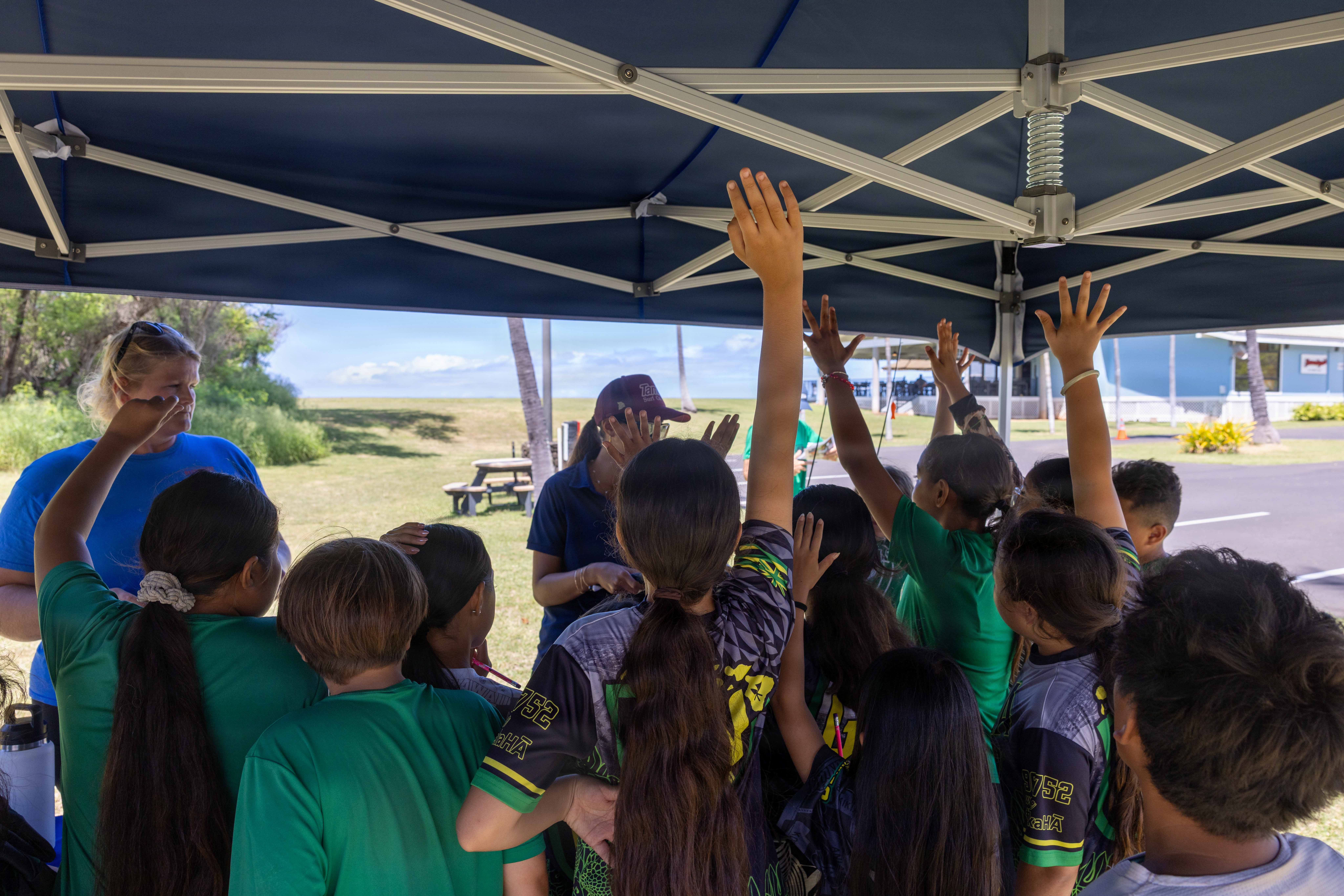 Students visiting PMRF answer questions about sea life in the waters surrounding Kaua‘i.